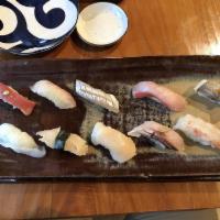 10 Piece Assorted Sashimi · Piece of fish.
