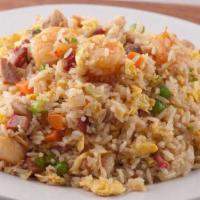 Combination Fried Rice · Chicken, BBQ pork and shrimp. Steamed rice stir fried with eggs, peas, carrots and green oni...