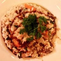 Wild Mushroom Risotto · Served with baby vegetables, balsamic glaze, truffle oil and Parmesan cheese. 