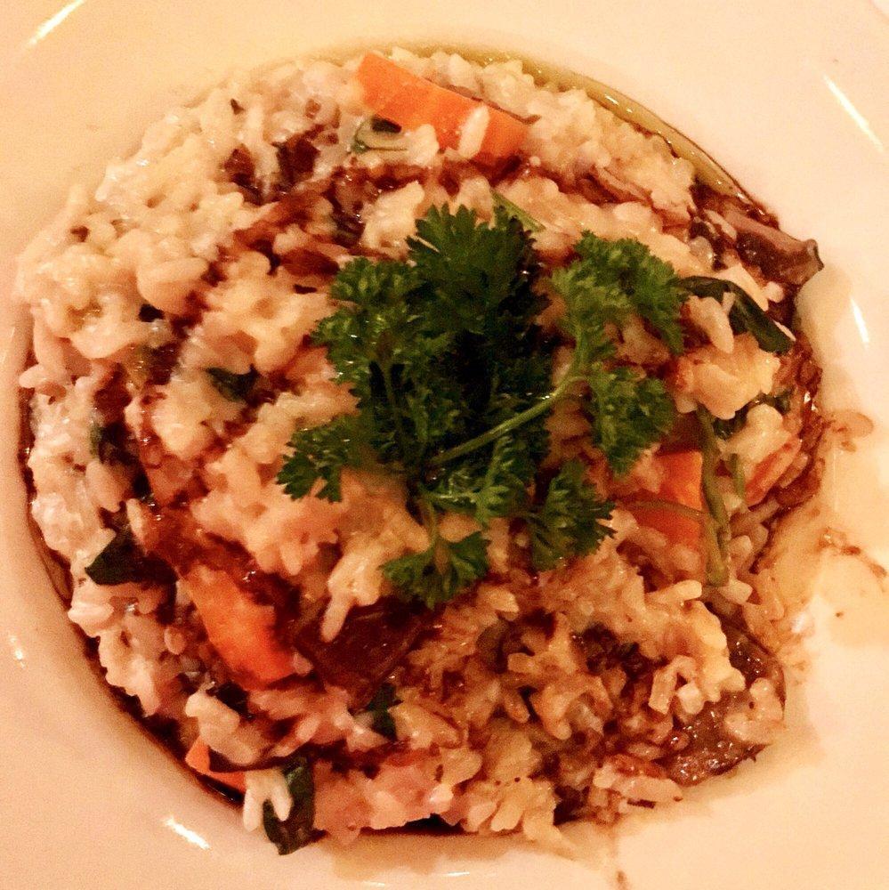 Wild Mushroom Risotto · Served with baby vegetables, balsamic glaze, truffle oil and Parmesan cheese. 