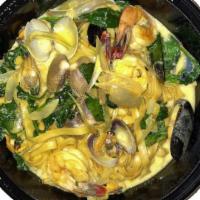 Seafood Pasta · Tagliatelle in a saffron broth with shrimp, mussels, clams and spinach. 