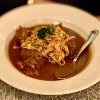 Classic Coq Au Vin · Red wine chicken stew with bacon, carrots, mushrooms and fresh pasta. 