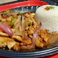 Pollo Saltado · Peruvian stir fry combining marinated chicken, red onions, spring onions, tomatoes and cilan...