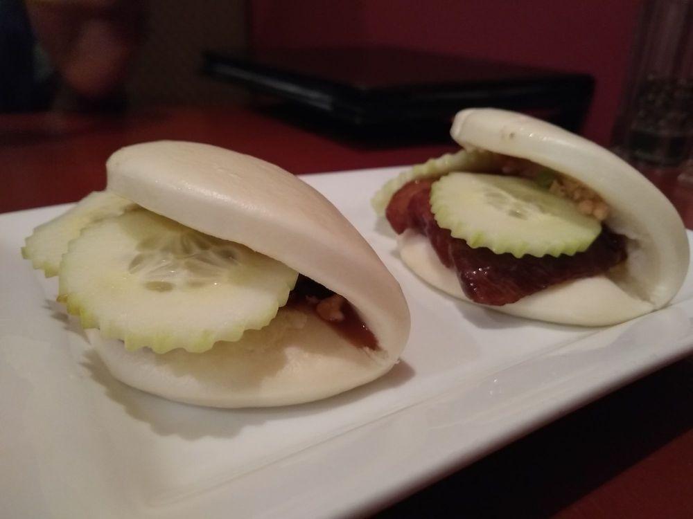 Steamed Pork Buns · Stewed pork belly, scallions, cucumber and crushed peanuts.