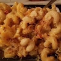 Lobster Mac · Chunks of lobster sauteed in white wine, mixed with Swiss and cheddar cheese, topped with fr...
