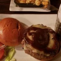 Sweet Onion Burger · Beef patty mixed with sweet onions topped with Gruyere Swiss cheese and BBQ sauce. This menu...