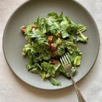 Caesar Salad · Crisp romaine tossed with house made croutons, Parmesan and diced red onions our scratch mad...
