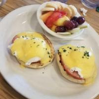 Eggs Benedict · Poached eggs, Canadian bacon, toasted English muffin, creamy hollandaise. Choice of side.