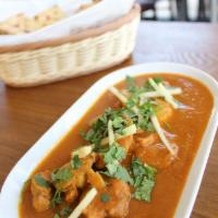 Butter Chicken · Chicken simmered in a creamy tomato-based gravy. Served with rice.  Served with rice or naan.
