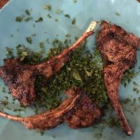 Lamb Chops · 2 pieces. Lamb chops seasoned with parsley and pepper with Rice