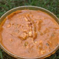 Shai Paneer · Fresh homemade grated cheese cooked in a tomato based almond cream sauce with fresh green pe...