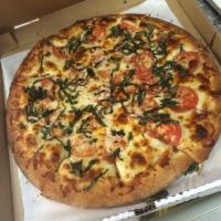 Margarita Pizza · Olive oil, garlic, mozzarella, sliced fresh tomatoes, and basil.