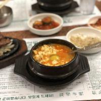 Oyster Tofu Soup · Soup made from bean curd.
