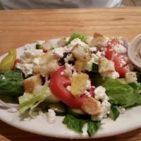 Greek Salad · Romaine, tomato, cucumber, onion, feta, pepperoncinis, kalamatta olives and croutons.