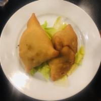 Vegetable Samosas · Mildly spiced and deep fried turnovers. Served with mint chutney.