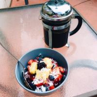 Acai Bowls · Acai, almond milk, blueberries, strawberries, banana, granola and shredded coconut.