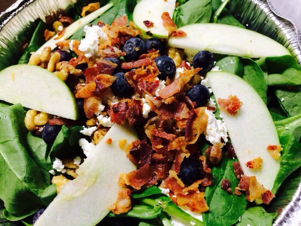Raspberry Spinach Salad · Topped with goat cheese, walnuts, bacon, apples, and blueberries, served with homemade raspberry dressing.