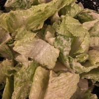 Caesar Salad · Romaine lettuce cut in inch and baked croutons tossed with grated Parmesan cheese and homema...