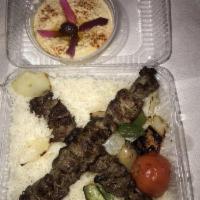 Lamb Kabob · Charbroiled and marinated lamb. Served with two sides, pita bread and a veggie skewer.