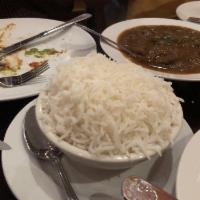 Basmati Rice · Steamed imported basmati rice. Vegan and gluten free.