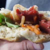 Savory BBQ Pork Sandwich · Tender marinated pork, pickled daikon and carrots, cucumber, cilantro, jalapeno, house garli...