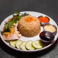 Hainan Chicken Rice · Poached organic chicken, jasmine rice, cucumber, garlic crush, housemade ginger-chili sauces...