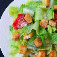 Caesar Salad · Romaine lettuce, tomatoes, croutons, Parmesan cheese and Caesar dressing.