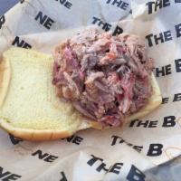 Pulled Pork Sandwich · Hand Shredded and tossed in our Carolina Style Vinegar Sauce, Served on a Toasted Bun with 1...