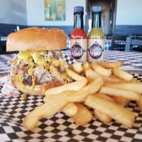 Pulled Pork Stacker Sandwich · Pulled pork topped with our homemade coleslaw, fried onion strings, and topped with Colorado...