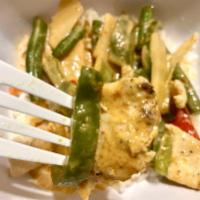 Red Curry · With coconut milk, bamboo shoots, bell peppers, green beans, and basil.