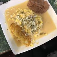 Huevos Rancheros · 2 eggs over corn tortillas topped with chile con queso served with hash-browns and beans.