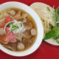 Special Combo Beef Noodle · Comes with thin slices of steak, brisket, flank, tendon, and meatballs with rice noodle. Pho...