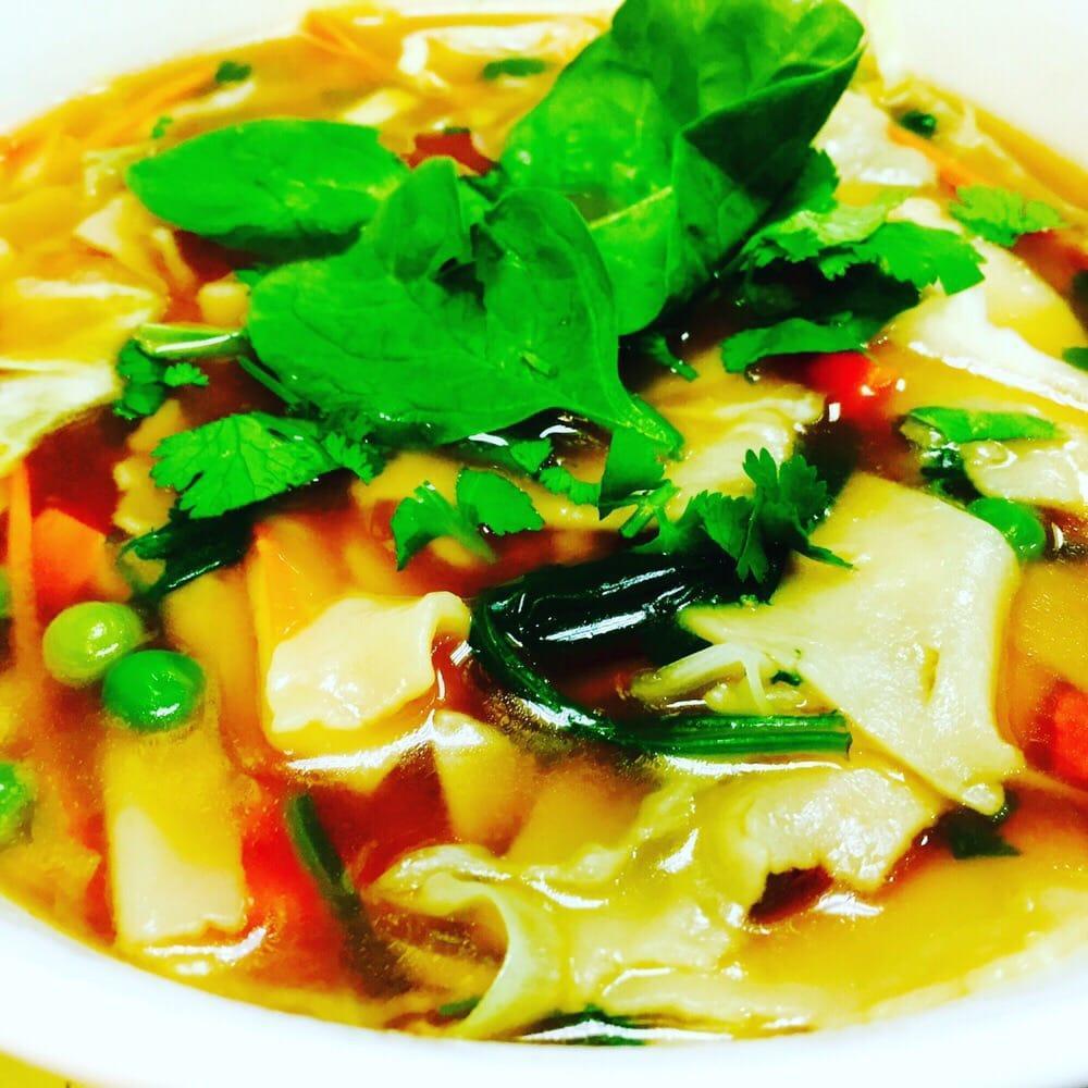 Handmade Noodle Soup · Then-thuk. Homemade traditional flat square noodles, cabbage, carrots and peas, soy sauce, cilantro and spinach. Vegetarian. Vegan.