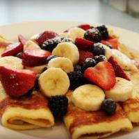 Fresh Fruit Crepes · 3 delicate crepes filled with sour cream and topped with fresh fruit, then dusted with powde...