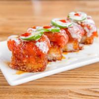 Crispy Rice with Spicy Tuna · Crispy rice squares topped with spicy tuna, jalapeno slices, sweet mayo, sweet sauce, and se...