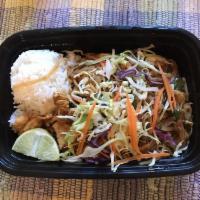 Pad Thai · Stir-fried thin rice noodles with eggs, green onions, bean sprouts and sliced lime with grou...