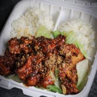 Crispy Garlic Chicken · Deep fried marinated chicken with shrimp paste house sauce. Served on top of lettuce. Comes ...