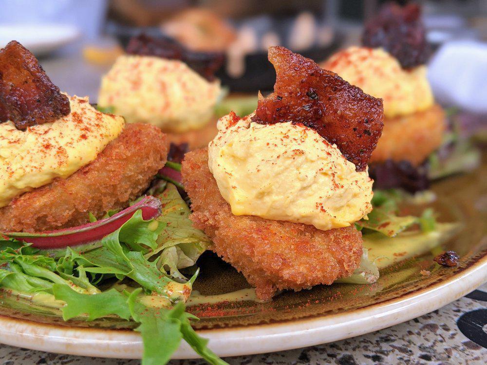 Crispy Deviled Eggs · Lightly fried, topped with smoked paprika + bacon candy. 750 calories.