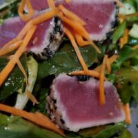 Seared Ahi Tuna Salad · Line caught, seared-rare furikake crusted yellowfin tuna, field greens, carrots, radish, avo...