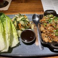 Chicken Lettuce Wraps · Chicken breast, water chestnuts, peanuts, carrots, sesame soy sauce, pickled cucumbers, roma...