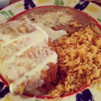 Chimichanga · Chunks of beef or chicken wrapped in a fried flour tortilla and topped with cheese sauce. Se...