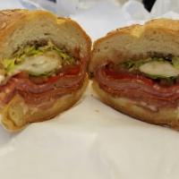 Genoa · Genoa salami, imported provolone, roasted red peppers, lettuce, tomato and Italian dressing.