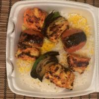 Chicken Shish Kebab · Thick strips of charbroiled chicken breast marinated in our special sauce. Comes with bell p...