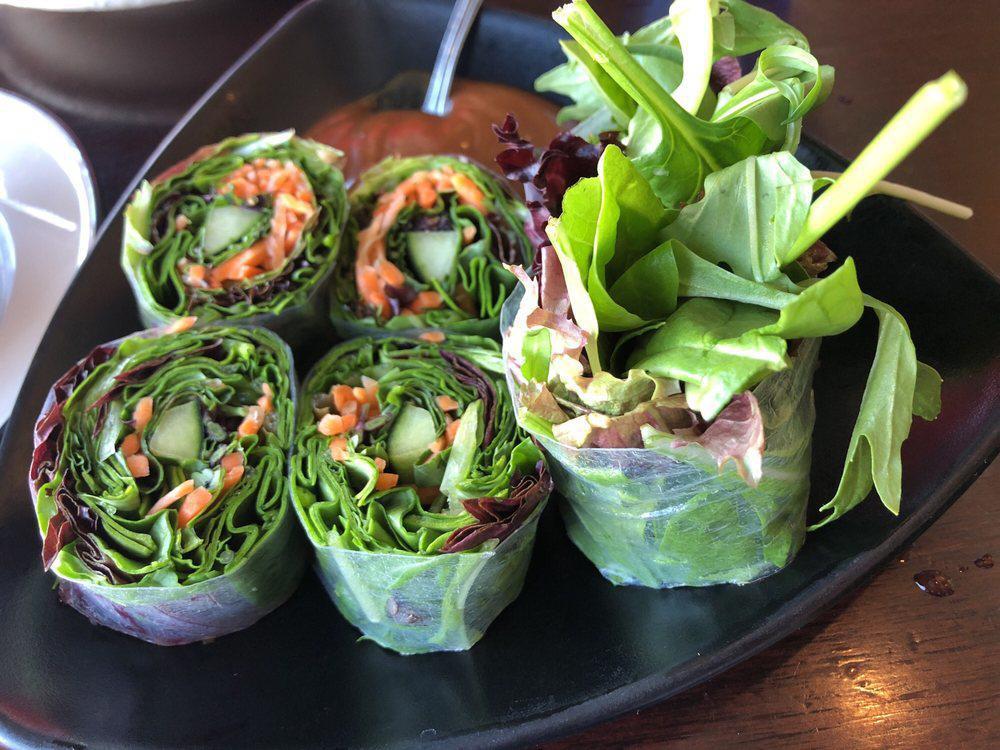 Summer Rolls · Cut to 6. Mix green, cucumbers, carrots, basil and cilantro wrapped in rice paper and served with peanut sauce. Vegan.