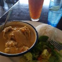 Yellow Chicken Curry · Chicken, potatoes and carro. Spicy.