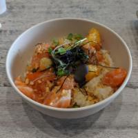 Salmon Ponzu Signature Bowl · Light, refreshing and delicate. Served with ponzu, orange, edamame, fried garlic, Maldon sal...