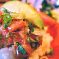 Salmon Poke Bowl · Marinated salmon, baby kale, quinoa, avocado, rice.