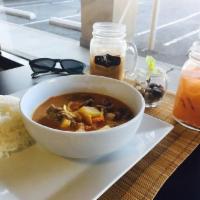 Massaman Curry · Choice of beef or chicken cooked in curry paste, coconut milk, onions, potatoes, peanuts and...