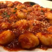 Gnocchi · With red sauce. Served with soup, garden or Caesar salad, and bread.

