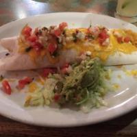 Carne Asada Burrito · Large flour tortilla stuffed with tender skirt steak, beans and rice top with your choice of...